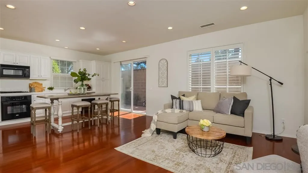12 Night Bloom Irvine, CA 92602 - Photo 3 of 25 a living room with furniture and a table