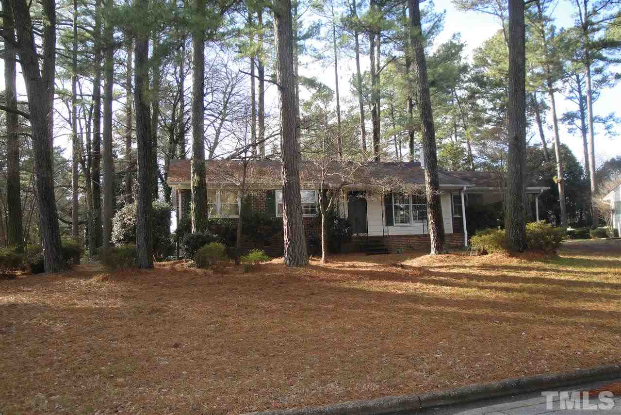 5001 Auburn Road Raleigh, NC 27609 - Photo 17 of 20 a backyard of a house with large trees and outdoor seating