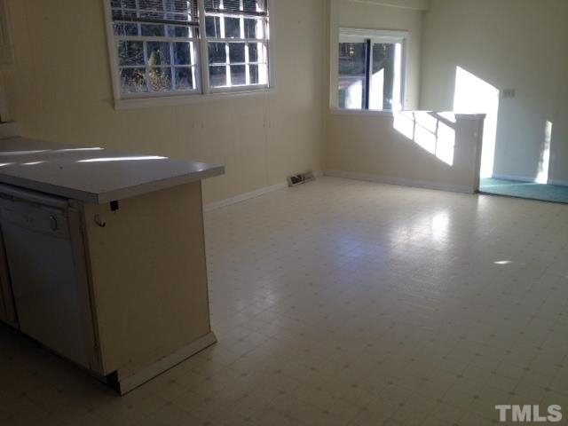 5001 Auburn Road Raleigh, NC 27609 - Photo 5 of 20 a view of an empty room with windows