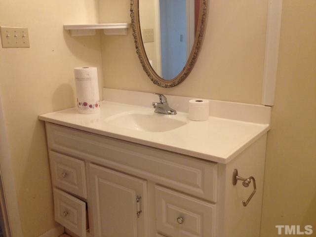 5001 Auburn Road Raleigh, NC 27609 - Photo 10 of 20 a bathroom with a sink and a mirror
