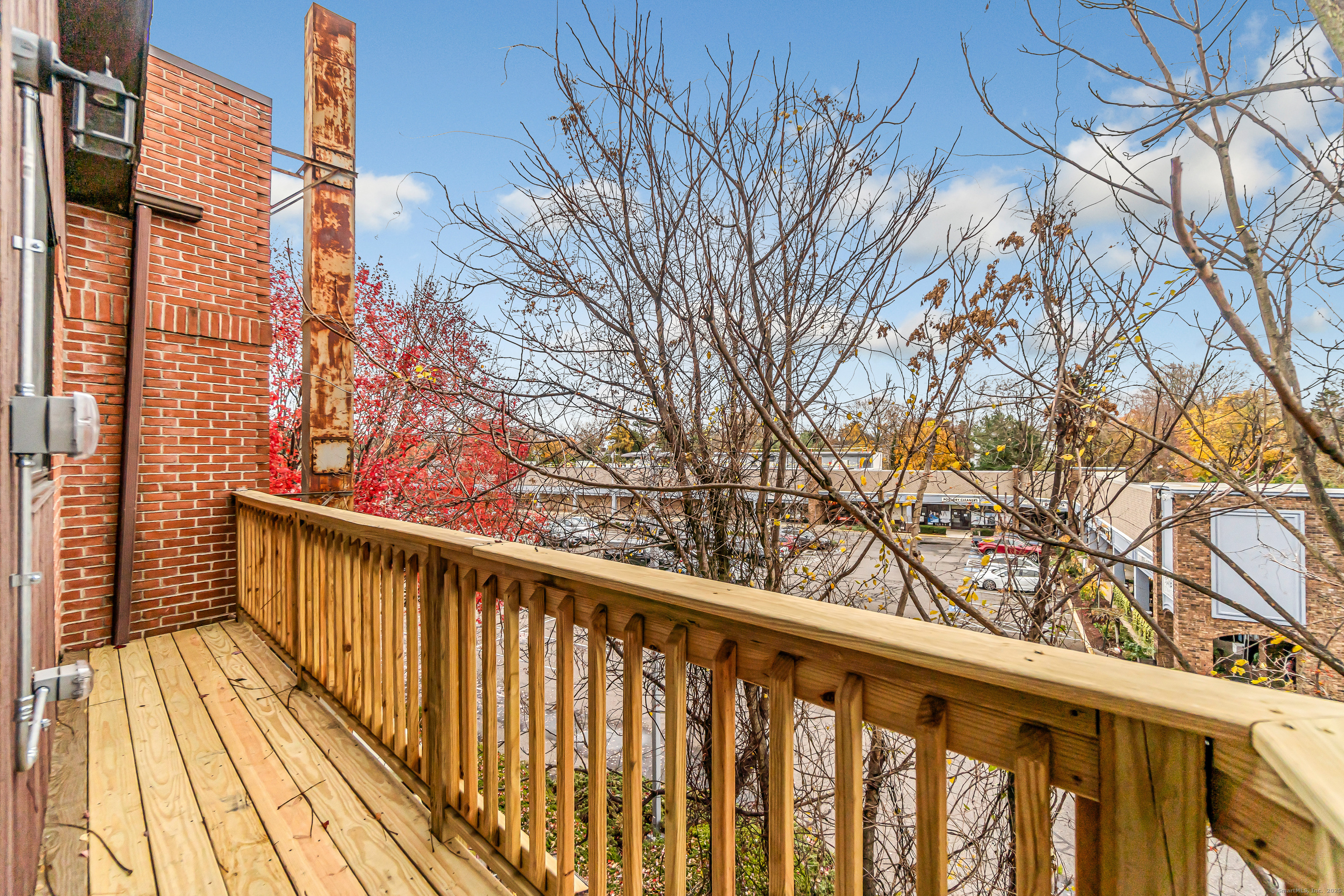 937 Post Road, Unit 3A Fairfield, CT 06824 - Photo 13 of 24 a view of wooden balcony with wooden floor