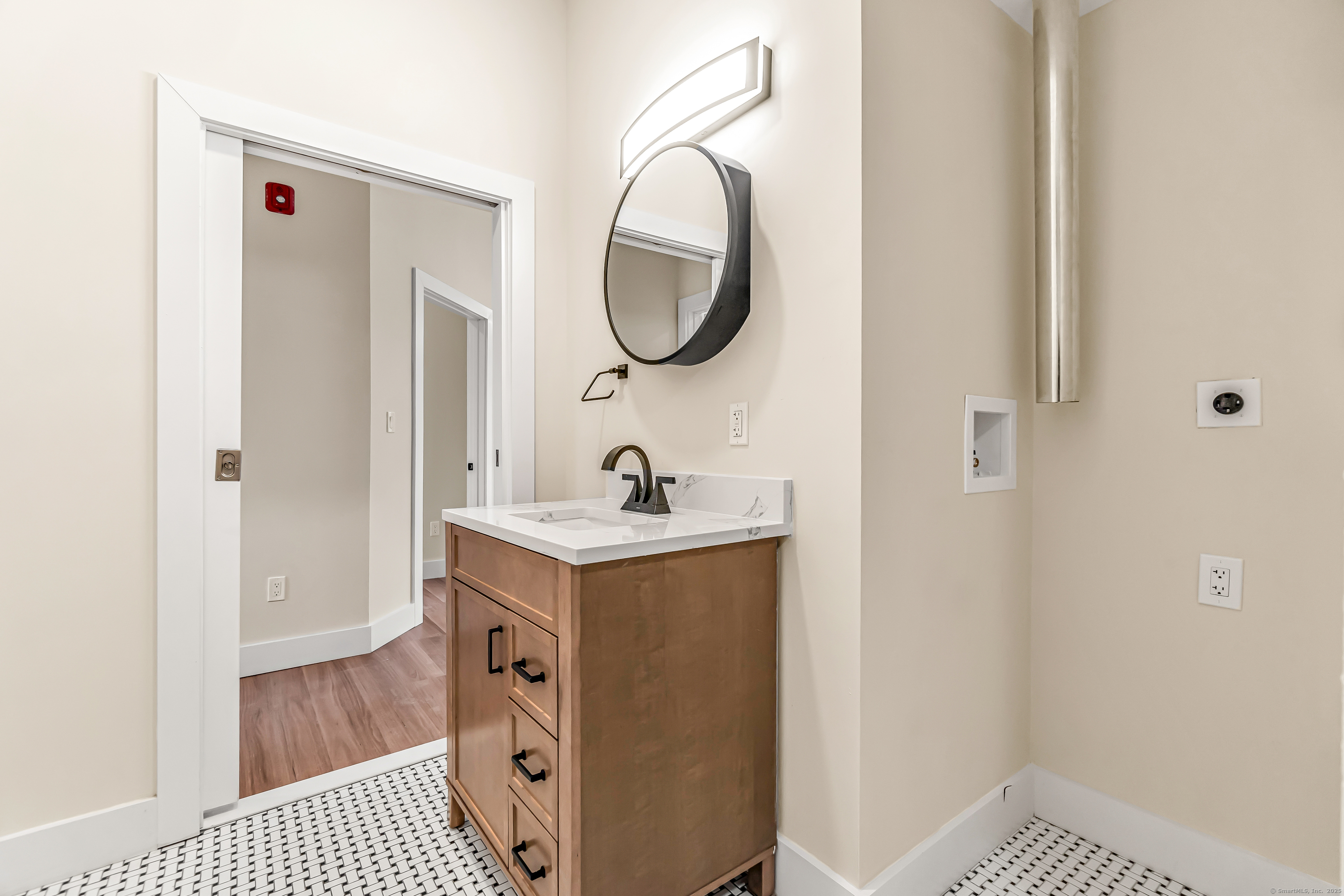 937 Post Road, Unit 3A Fairfield, CT 06824 - Photo 20 of 24 a bathroom with a sink a mirror and a shower