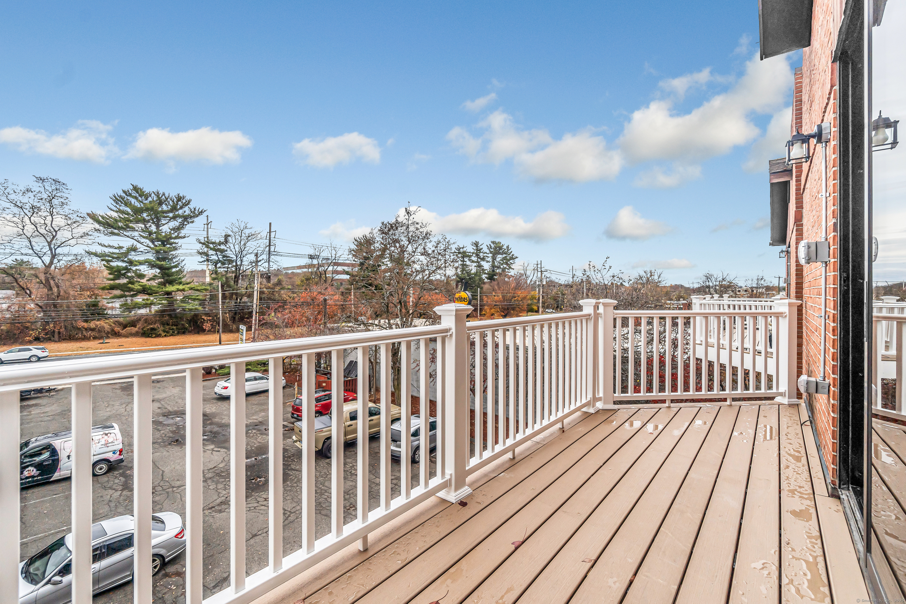 937 Post Road, Unit 3A Fairfield, CT 06824 - Photo 22 of 24 a view of city from a balcony
