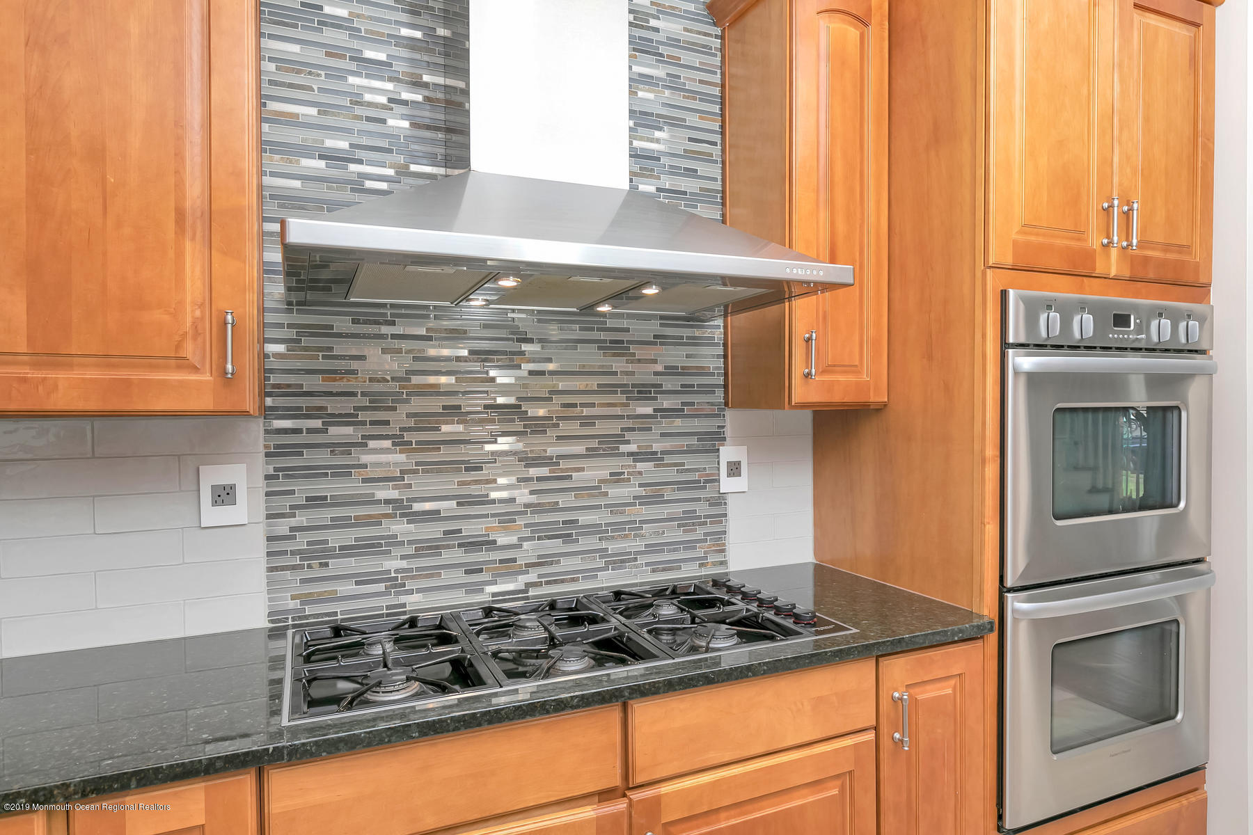 1614 Barkalow Road Wall, NJ 07719 - Photo 12 of 41 a stove top oven sitting inside of a kitchen