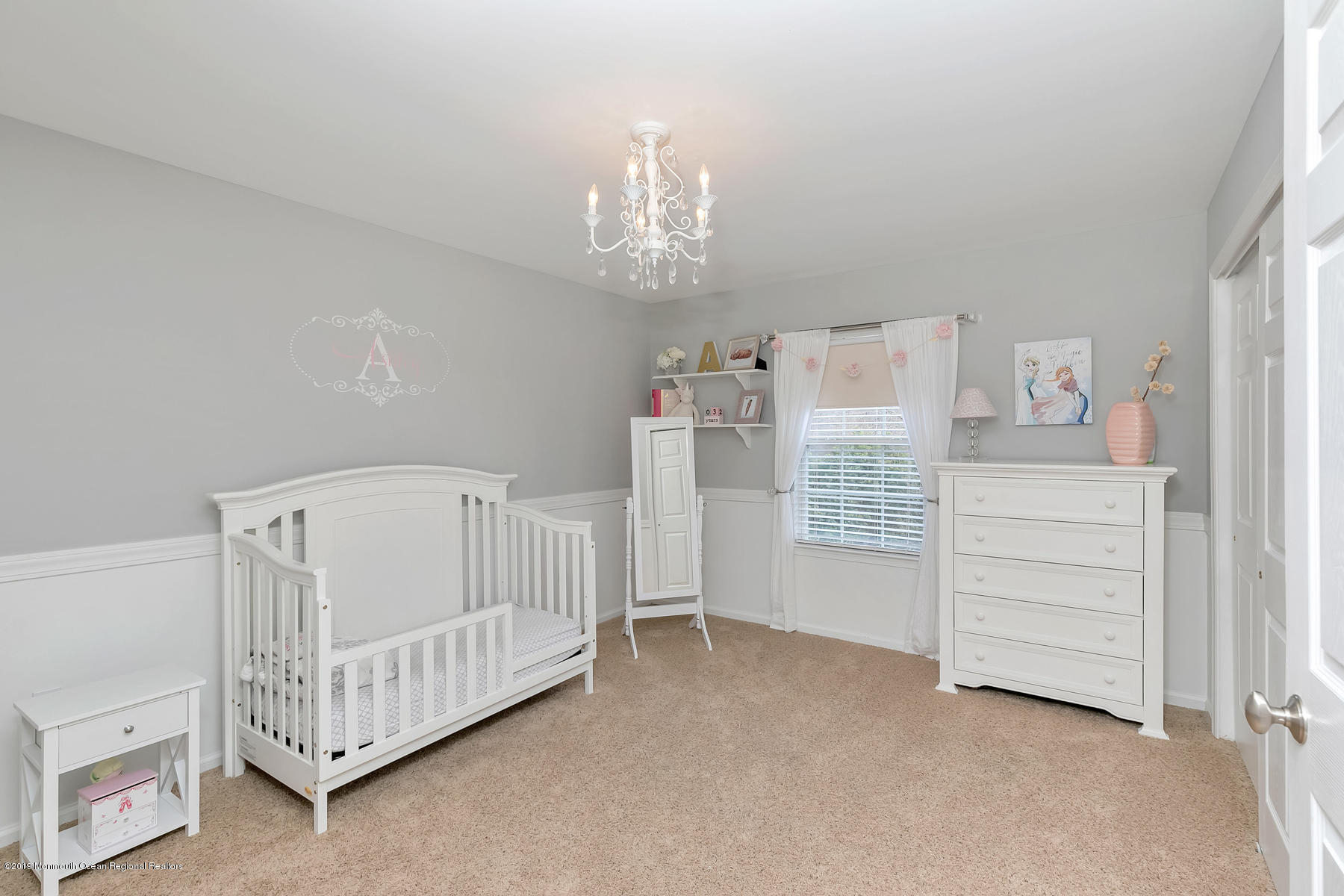 1614 Barkalow Road Wall, NJ 07719 - Photo 19 of 41 a bedroom with furniture and a chandelier