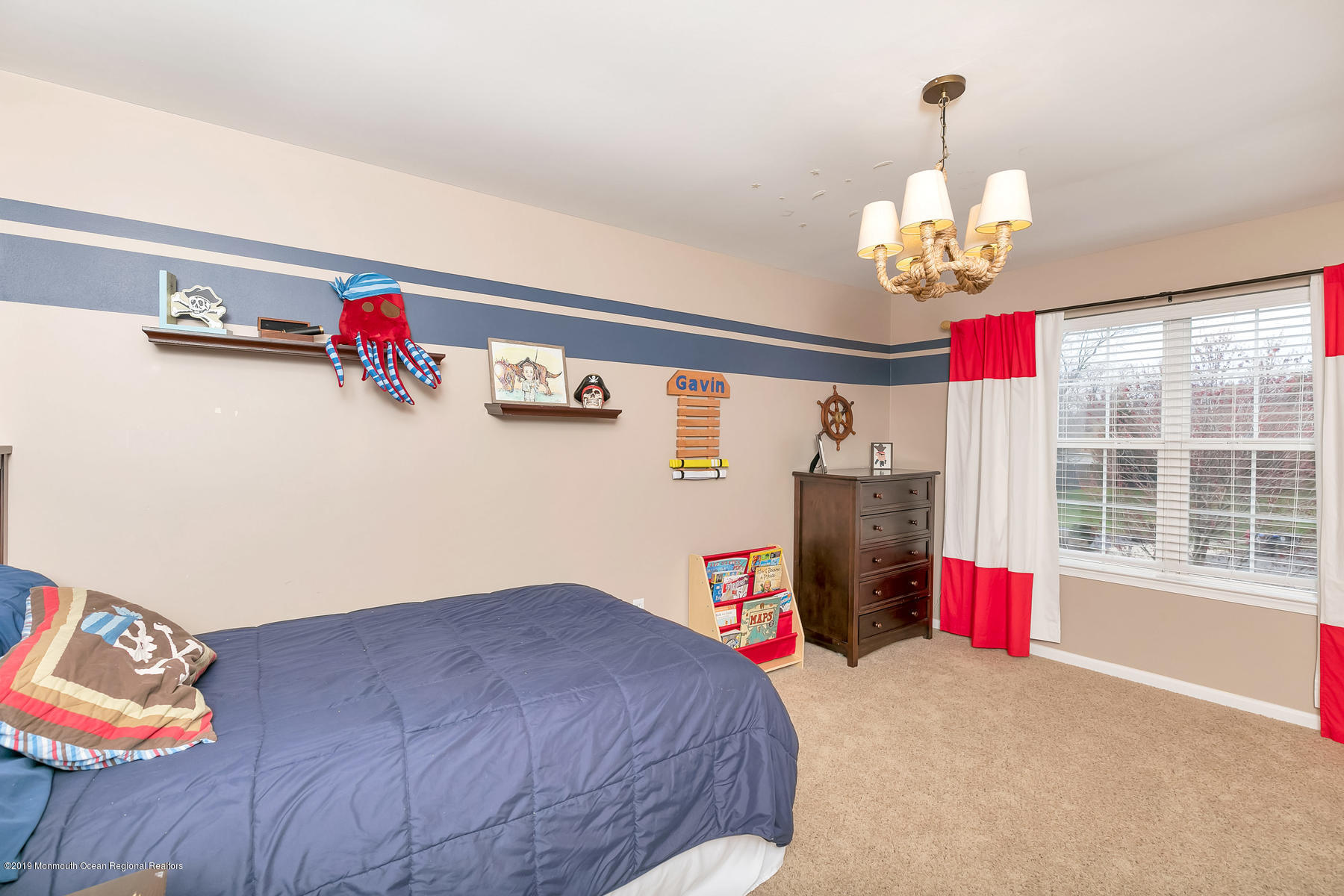 1614 Barkalow Road Wall, NJ 07719 - Photo 20 of 41 a bedroom with a bed dresser and a chandelier