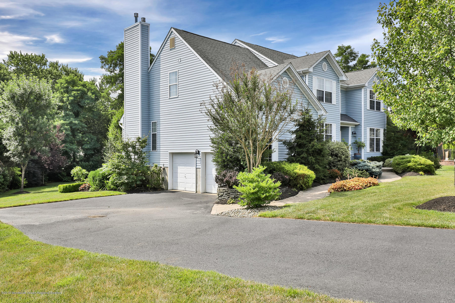 1614 Barkalow Road Wall, NJ 07719 - Photo 27 of 41 a front view of a house with a garden and plants