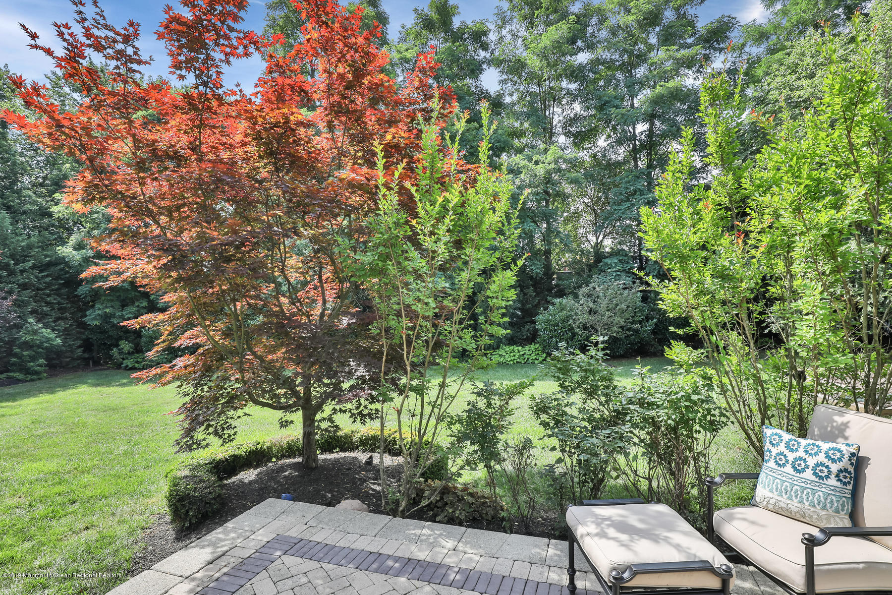 1614 Barkalow Road Wall, NJ 07719 - Photo 36 of 41 a view of a backyard with plants and a patio