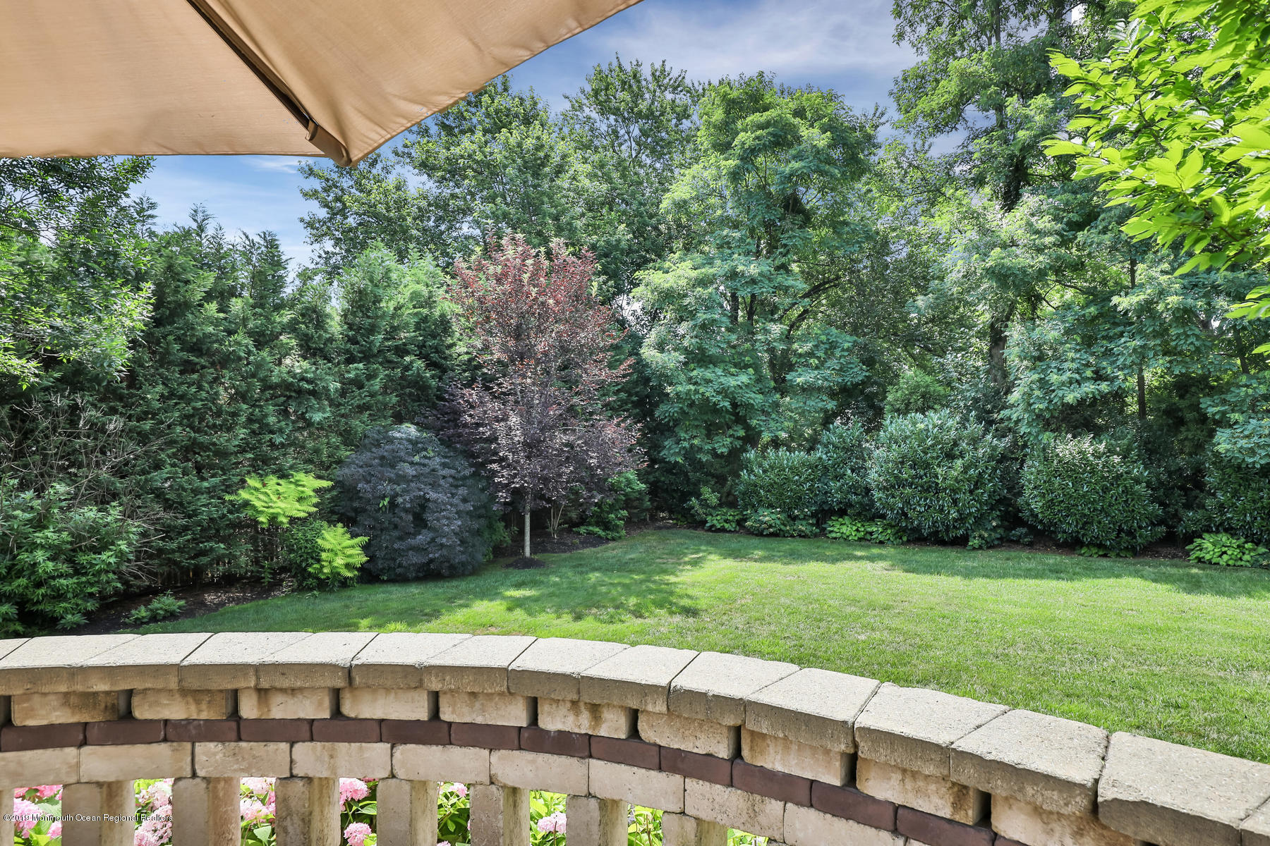 1614 Barkalow Road Wall, NJ 07719 - Photo 40 of 41 a view of a backyard with a garden