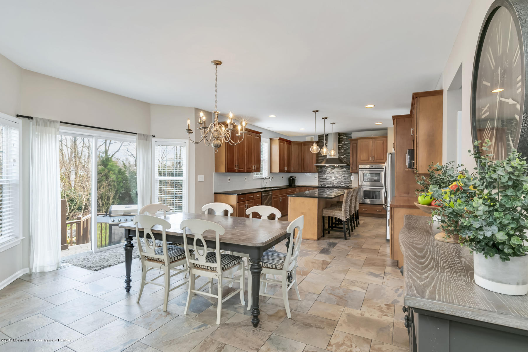 1614 Barkalow Road Wall, NJ 07719 - Photo 8 of 41 a kitchen with a table and chairs in it