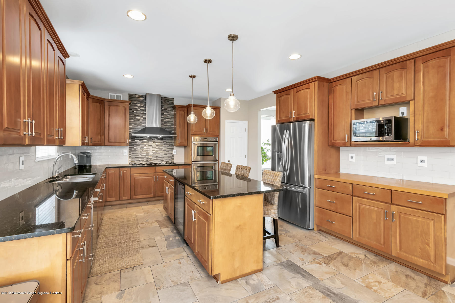 1614 Barkalow Road Wall, NJ 07719 - Photo 10 of 41 a kitchen with stainless steel appliances granite countertop a stove top oven a refrigerator a sink and dishwasher