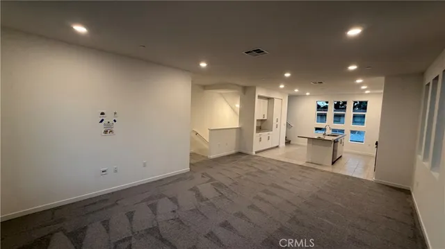 a view of a room with gym equipment and entryway