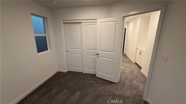 a view of a room with wooden walls