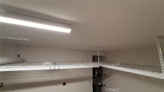 a room with a table and chandelier