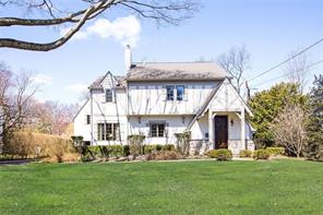 16 Hix Avenue Rye, NY 10580 - Photo 1 of 1 a front view of a house with a garden