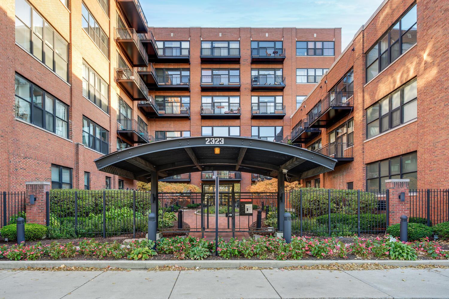 a front view of a building with garden