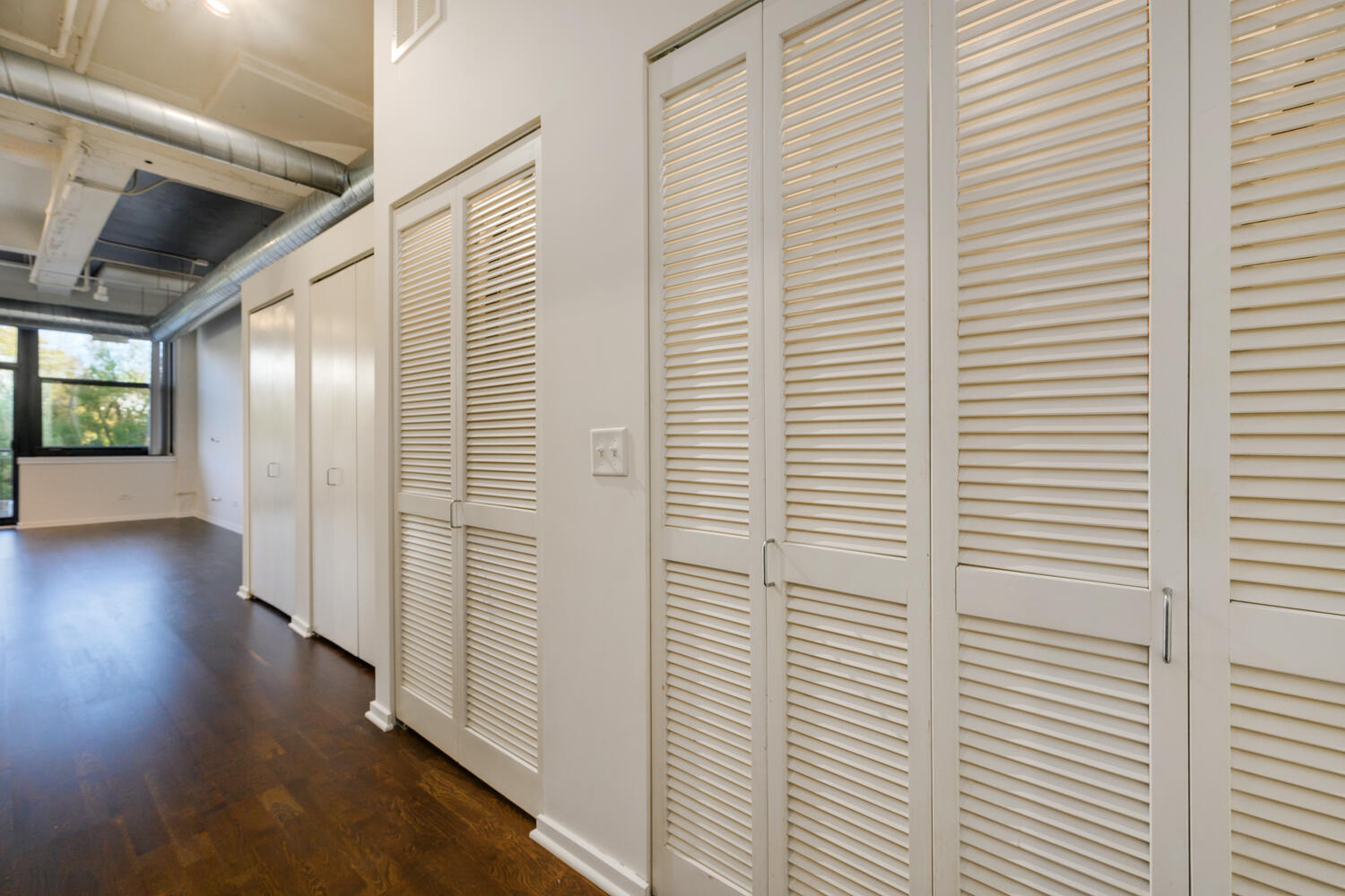 2323 West Pershing Road, Unit 222 Chicago, IL 60609 - Photo 12 of 22 a view of a hallway with wooden floor