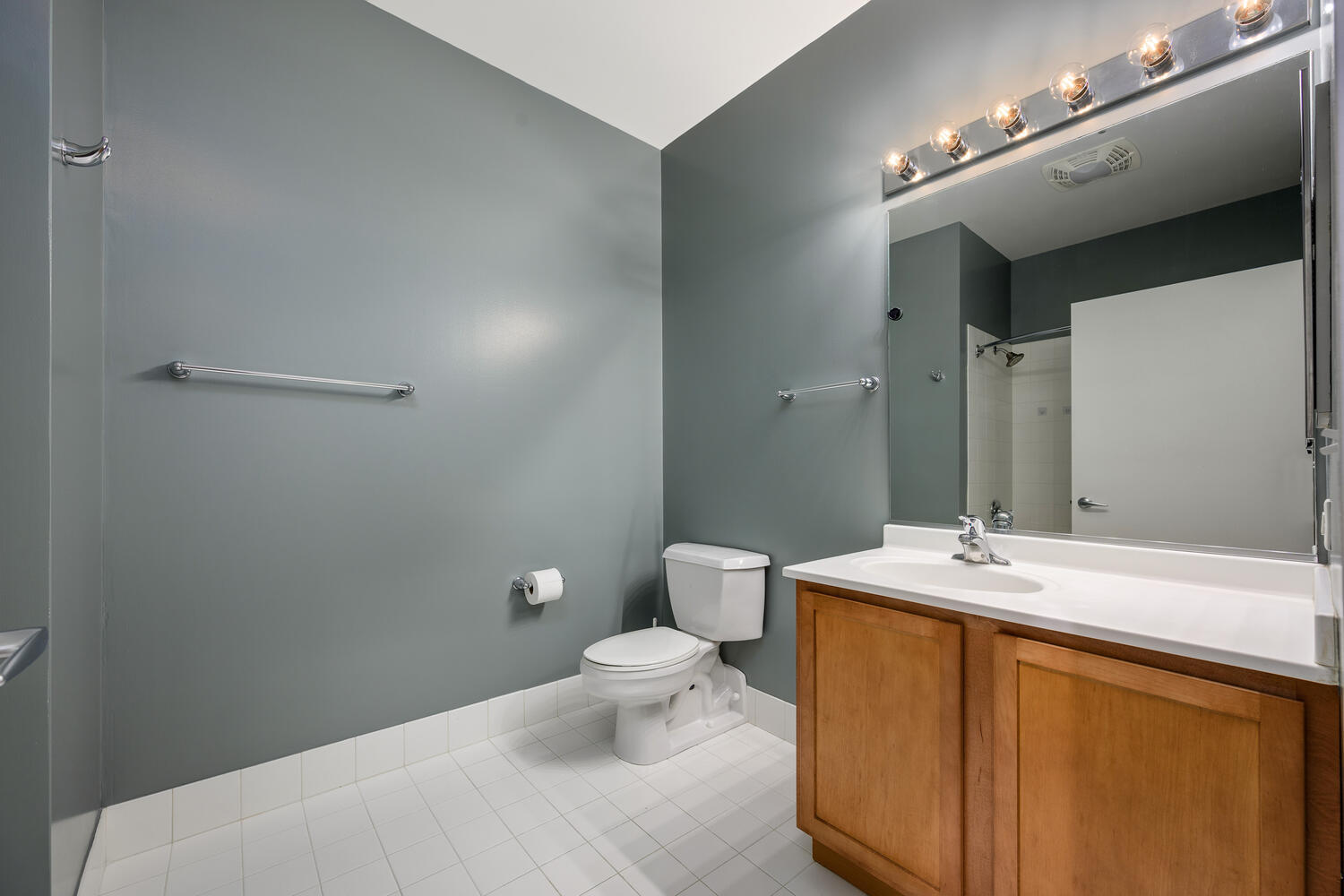 2323 West Pershing Road, Unit 222 Chicago, IL 60609 - Photo 14 of 22 a bathroom with a sink toilet and a mirror