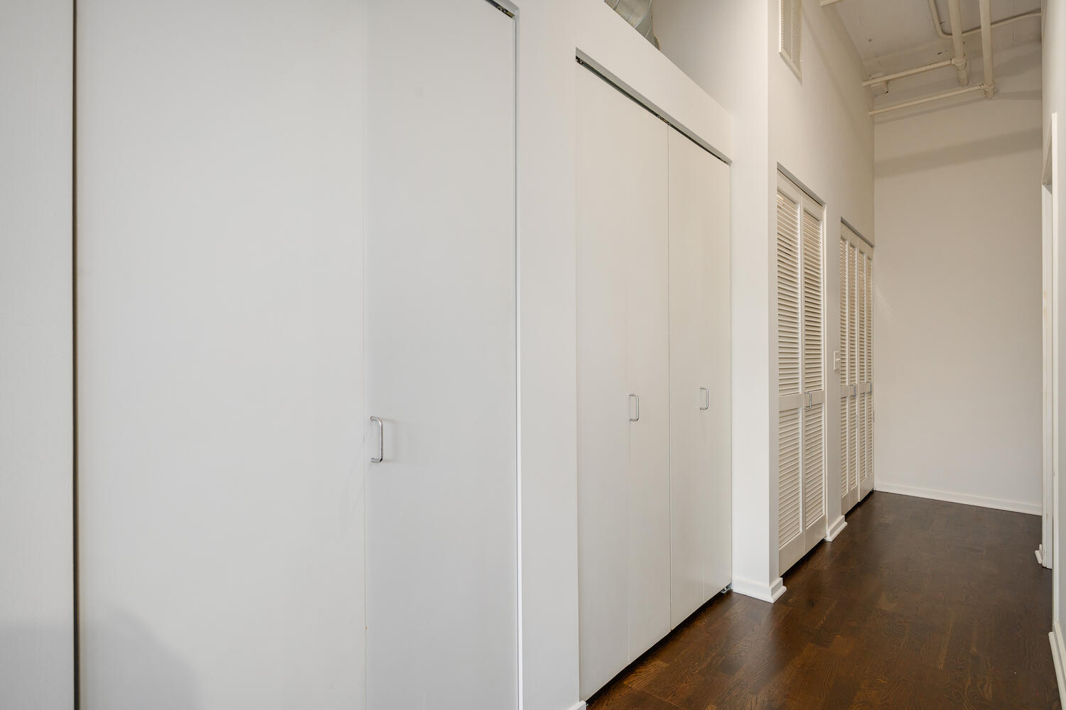 2323 West Pershing Road, Unit 222 Chicago, IL 60609 - Photo 19 of 22 a view of a hallway with wooden floor