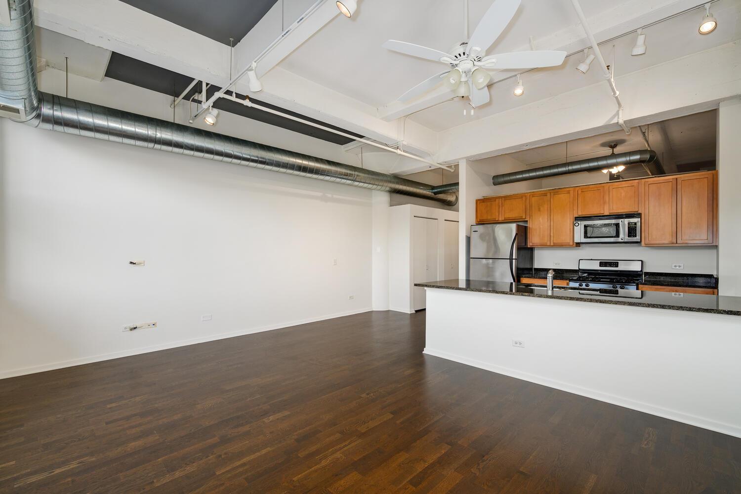 2323 West Pershing Road, Unit 222 Chicago, IL 60609 - Photo 7 of 22 a kitchen with stainless steel appliances a stove top oven a sink and a refrigerator