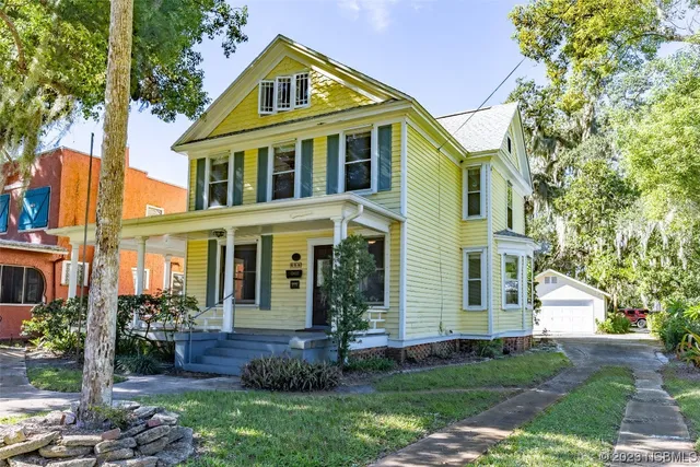 a front view of a house with a glass door