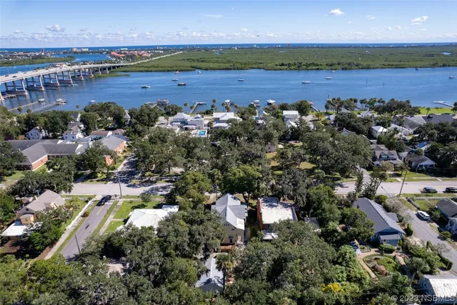 an aerial view of a residential houses with outdoor space