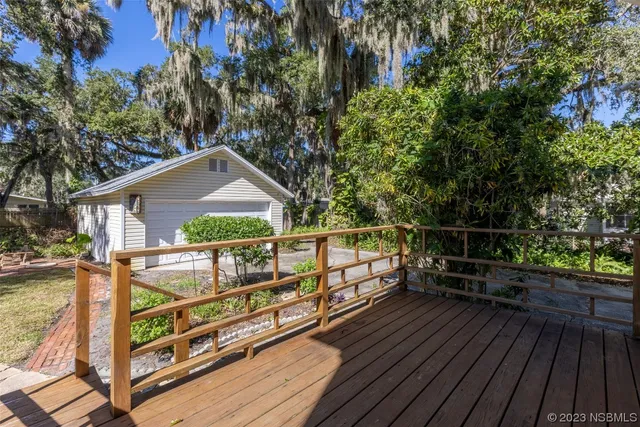 an aerial view of a houses with a swimming pool