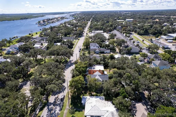an aerial view of a house with a yard and garden