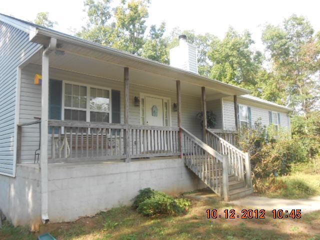 110 Mountain Ridge, Unit 232 Covington, GA 30016 - Photo 1 of 1 a view of a house with a small yard and wooden floor and fence