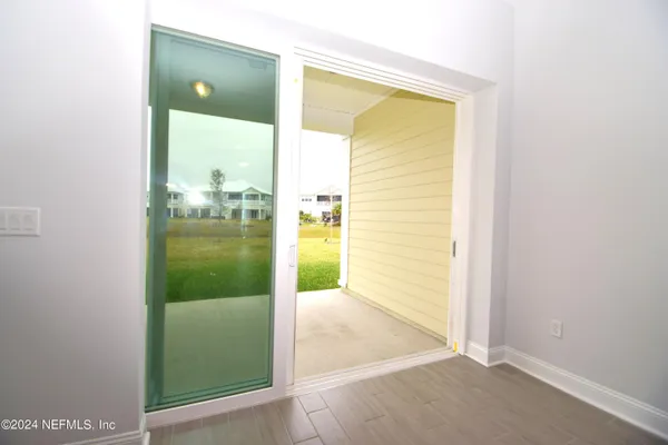 a view of swimming pool from a living room