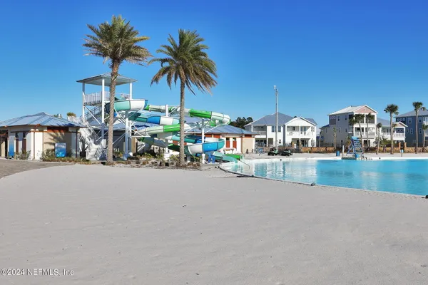 a view of a room with gym equipment and a table