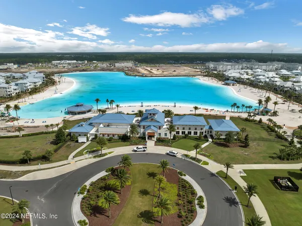 an aerial view of a house with yard swimming pool and outdoor seating