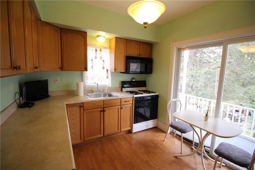 1334 Hamilton Road Pittsburgh, PA 15234 - Photo 8 of 22 Updated kitchen includes all the appliances. Bright & cheery with a sliding glass door to deck.