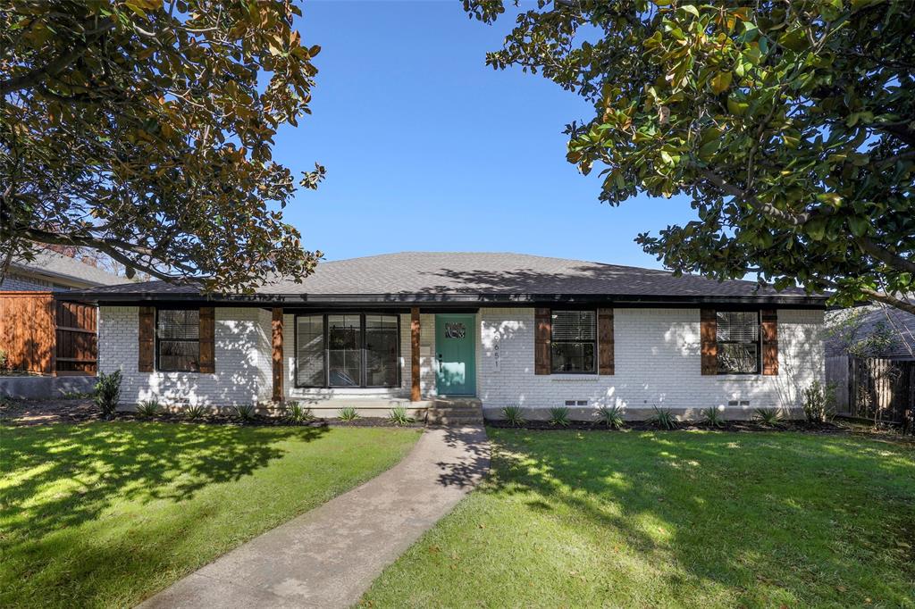 a front view of house with yard and outdoor seating