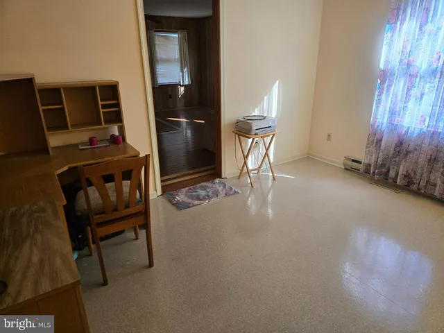 a living room with closet and a window