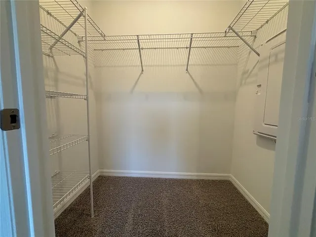 a spacious bathroom with a granite countertop sink toilet and shower
