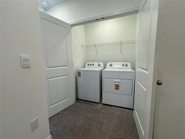 a view of a bathroom from a hallway
