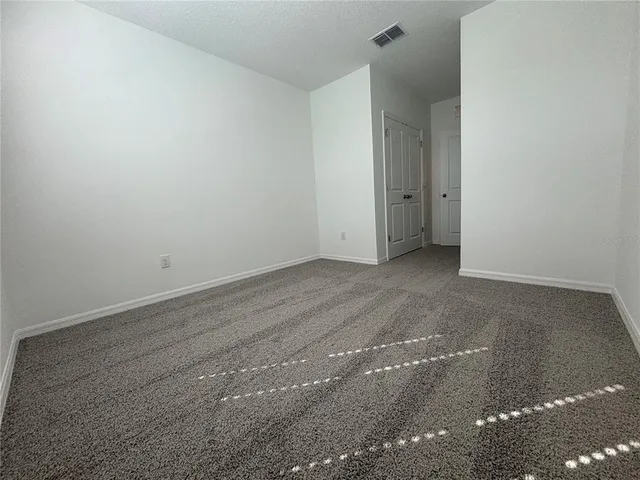 an empty room with an entryway door