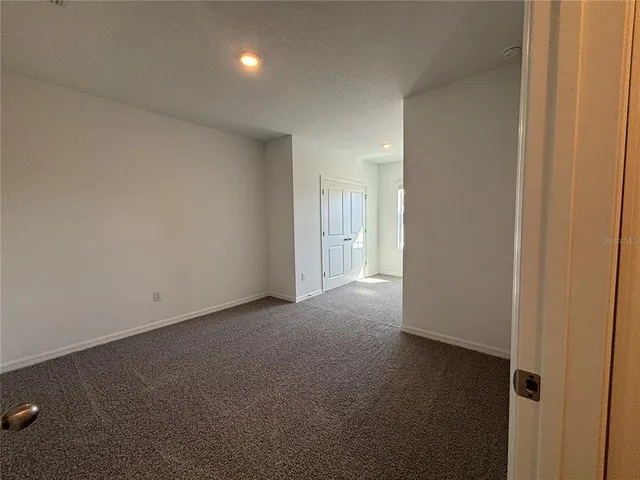 a view of hallway with windows