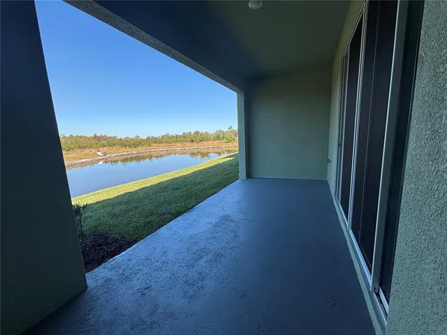 a view of a swimming pool with a yard