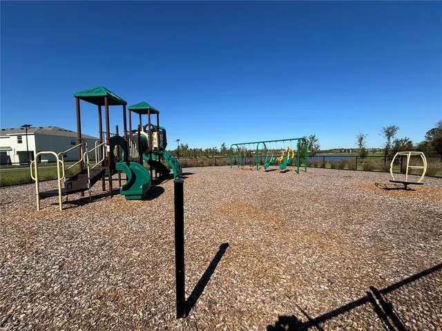a view of a field with an ocean