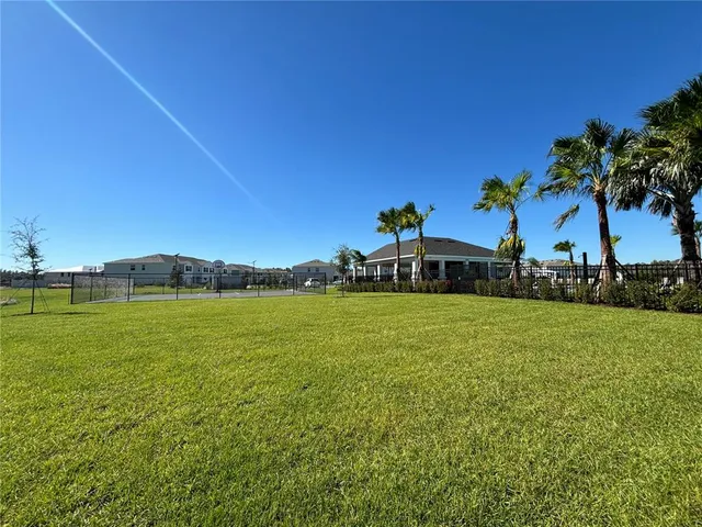 a view of a chairs and table in patio