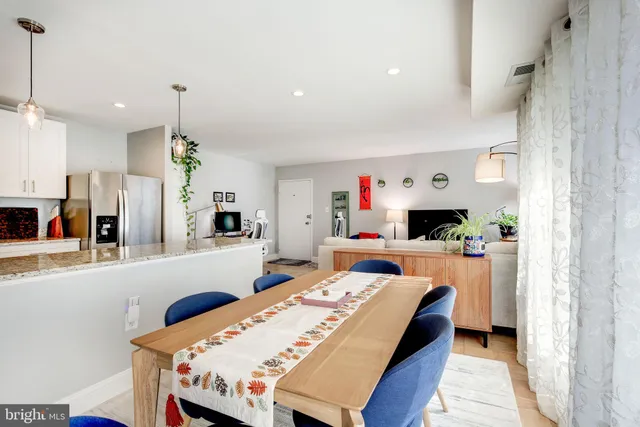 a very nice looking dining room with a table and chairs