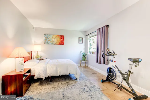 a bed room with a bed and a chair