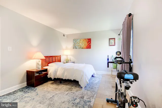 a bedroom with a bed and a table