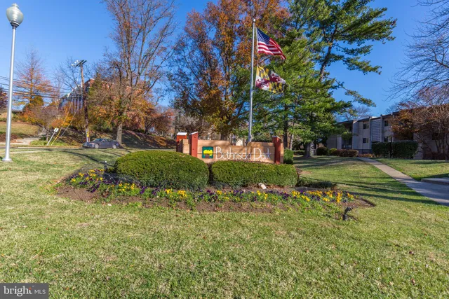 a view of a garden with a house