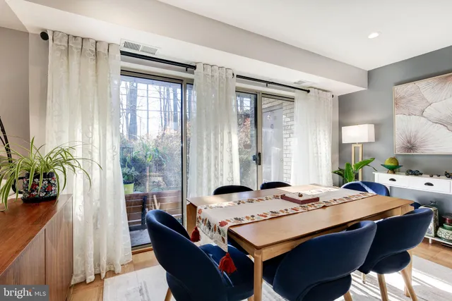 a dining room with a table and chairs