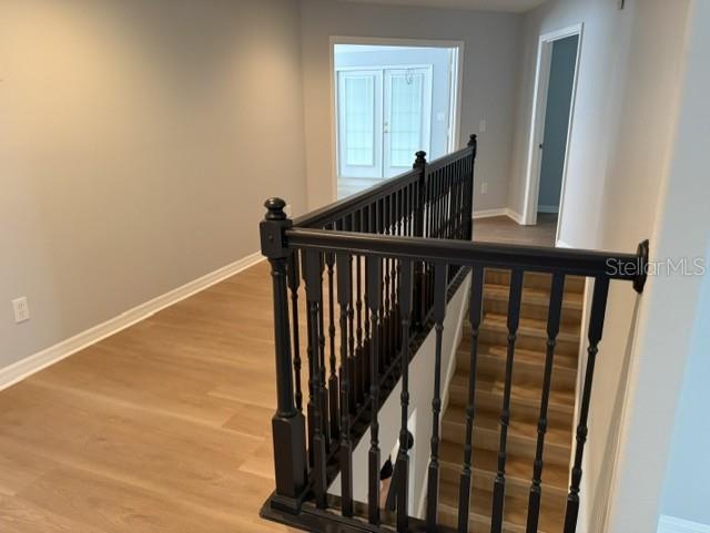 1885 Scrub Jay Road Apopka, FL 32703 - Photo 15 of 29 a view of staircase with wooden floor and white walls
