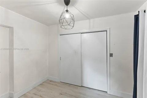 a view of a hallway with closet area