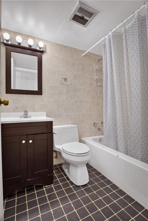 5 Bayard Road, Unit 418 Pittsburgh, PA 15213 - Photo 36 of 45 This updated bathroom offers a clean, a full-sized tub with shower, elegant tilework, and a warm wood vanity that provides both character and storage. Accented with tasteful decor and ample lighting, it’s a space that perfectly balances function and comfort.